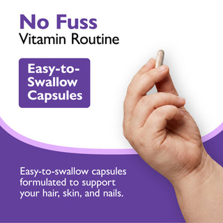 Promotional graphic for a vitamin routine showing a hand holding a single easy-to-swallow capsule against a white and purple background with text reading 'No Fuss Vitamin Routine' and 'Easy-to-Swallow Capsules.'.