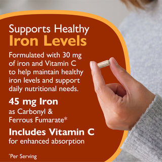 A close-up of a hand holding a small capsule, with a large orange text panel on the left reading 'Supports Healthy Iron Levels' and product details about 45 mg iron and vitamin C.