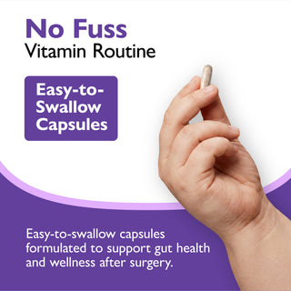 A hand holding a clear softgel vitamin capsule against a white and purple promotional background with text reading 'No Fuss Vitamin Routine' and 'Easy-to-Swallow Capsules.'.